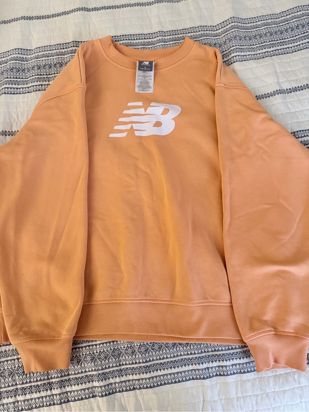 New Balance woman’s Orange Crewneck Sweatshirt